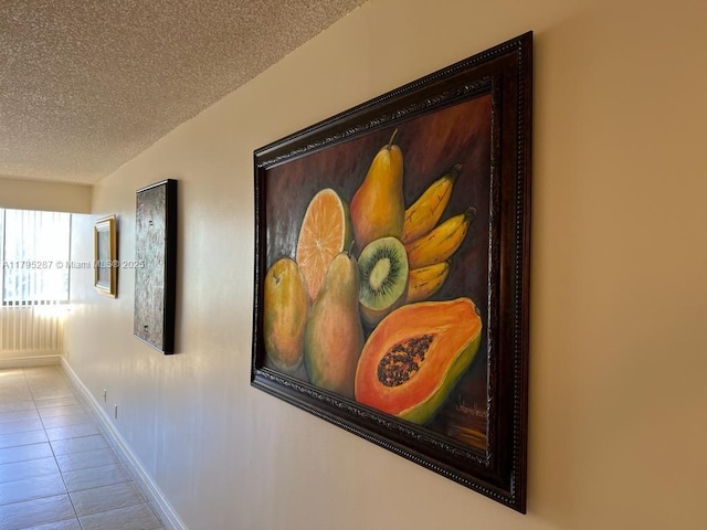 details featuring baseboards and a textured ceiling