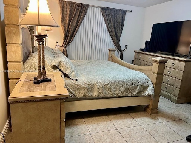 bedroom with light tile patterned floors