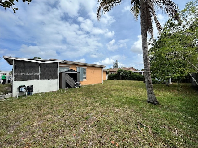 view of yard with a sunroom
