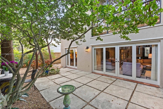 9033 SW 78th Pl, Miami, FL 33156 - back of property with a patio area, stucco siding, french doors, and fence