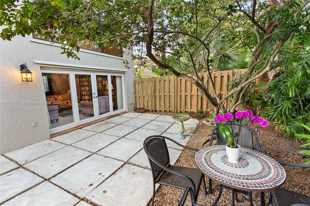 9033 SW 78th Pl, Miami, FL 33156 - view of patio featuring french doors and fence