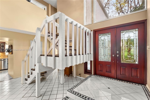 9033 SW 78th Pl, Miami, FL 33156 - foyer with stairway, a towering ceiling, baseboards, and french doors