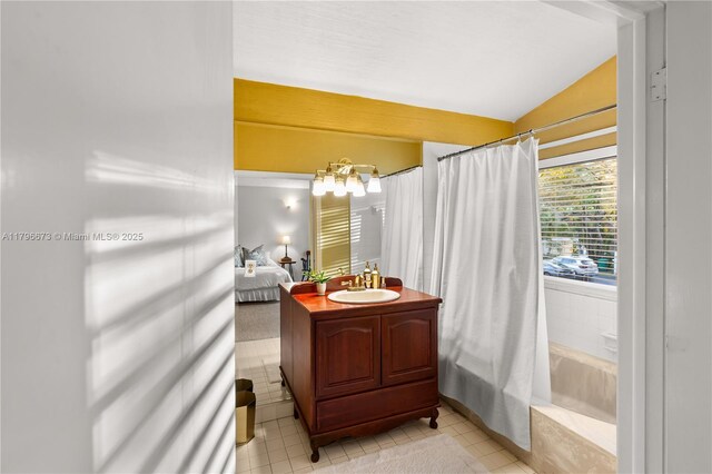 9033 SW 78th Pl, Miami, FL 33156 - bathroom with vaulted ceiling, a bath, vanity, tile patterned floors, and a shower with shower curtain