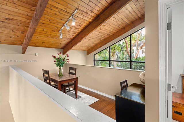 9033 SW 78th Pl, Miami, FL 33156 - dining space featuring track lighting, wooden ceiling, beam ceiling, dark wood finished floors, and baseboards