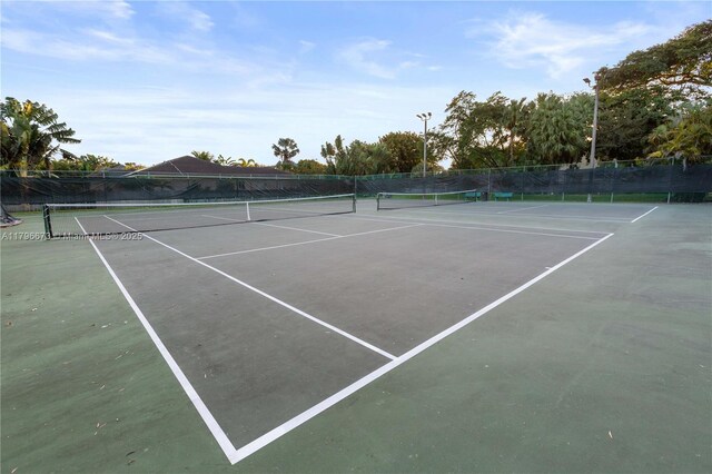 9033 SW 78th Pl, Miami, FL 33156 - view of tennis court with fence