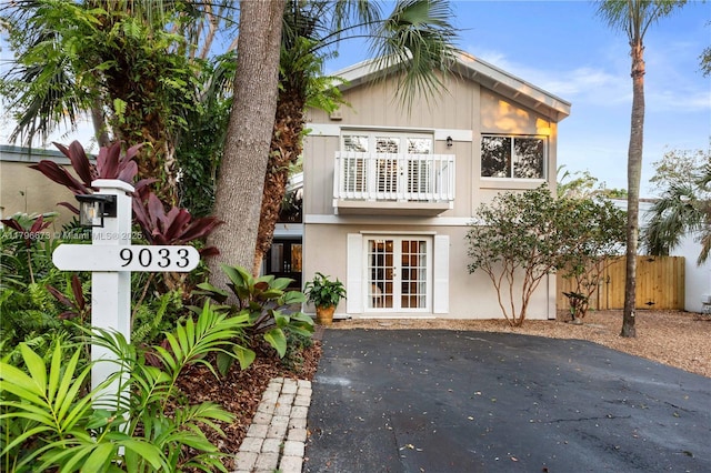 9033 SW 78th Pl, Miami, FL 33156 - view of front of home featuring fence, stucco siding, and french doors