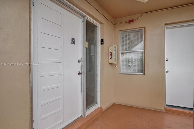 1301 NE 191st St Unit F417, Miami, FL 33179 - view of exterior entry with stucco siding