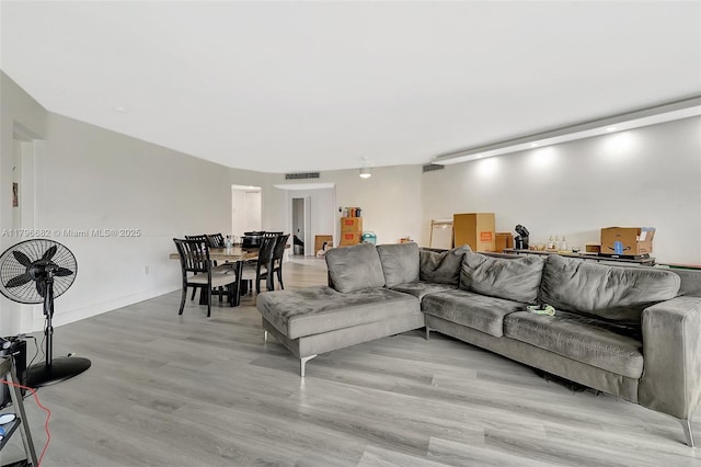 1301 NE 191st St Unit F417, Miami, FL 33179 - living room featuring visible vents and light wood-style flooring