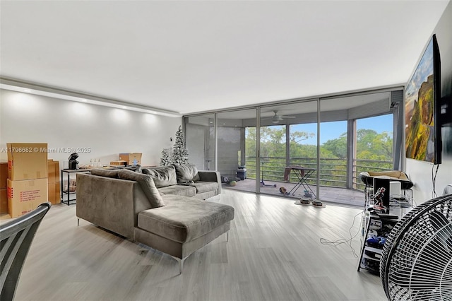 1301 NE 191st St Unit F417, Miami, FL 33179 - living area with ceiling fan, light wood-type flooring, and floor to ceiling windows