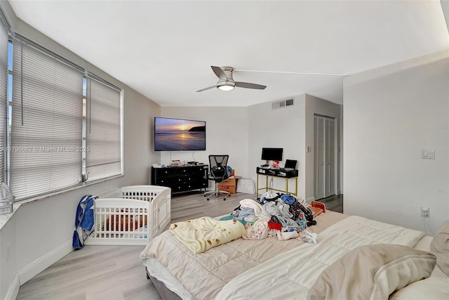 1301 NE 191st St Unit F417, Miami, FL 33179 - bedroom with baseboards, ceiling fan, visible vents, and wood finished floors