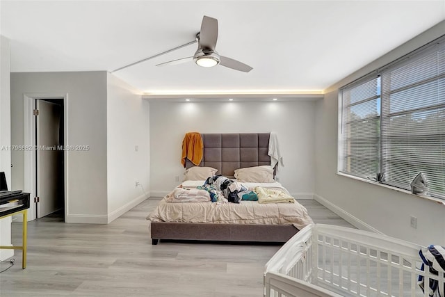 1301 NE 191st St Unit F417, Miami, FL 33179 - bedroom featuring baseboards, a ceiling fan, and wood finished floors