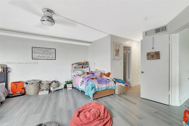1301 NE 191st St Unit F417, Miami, FL 33179 - bedroom with baseboards, ceiling fan, visible vents, and wood finished floors
