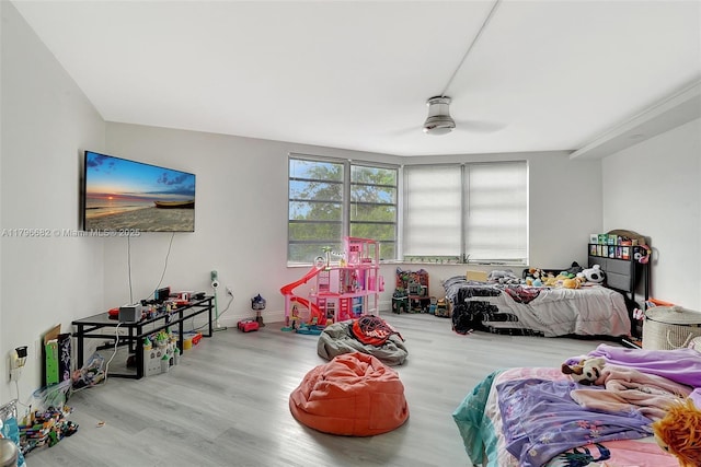 1301 NE 191st St Unit F417, Miami, FL 33179 - bedroom with baseboards, a ceiling fan, and wood finished floors