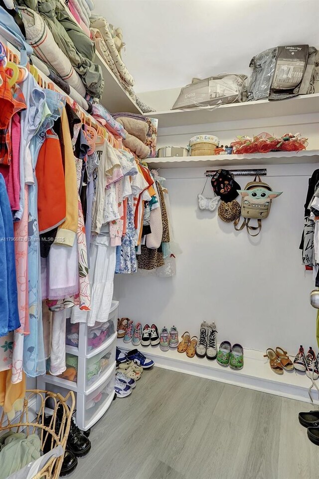 1301 NE 191st St Unit F417, Miami, FL 33179 - spacious closet featuring wood finished floors