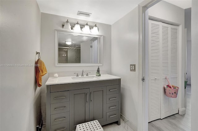 1301 NE 191st St Unit F417, Miami, FL 33179 - full bath featuring a closet, visible vents, baseboards, and vanity