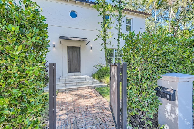 5812 Alton Rd, Miami Beach, FL 33140 - entrance to property with elevator and stucco siding