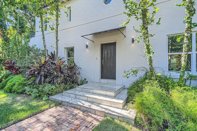 5812 Alton Rd, Miami Beach, FL 33140 - property entrance featuring stucco siding