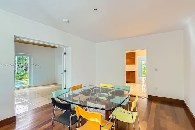 5812 Alton Rd, Miami Beach, FL 33140 - dining area with baseboards and wood finished floors
