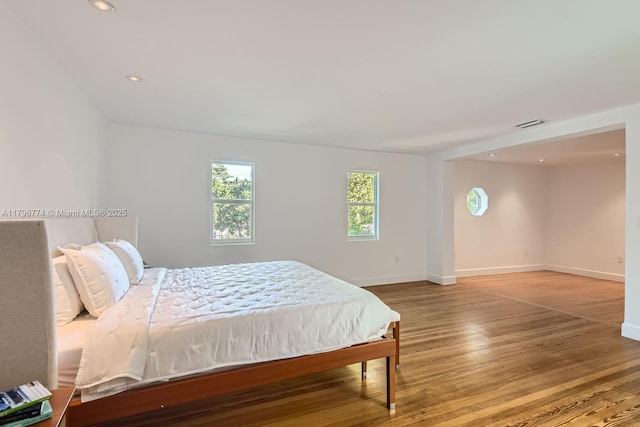 5812 Alton Rd, Miami Beach, FL 33140 - bedroom featuring baseboards, visible vents, recessed lighting, and wood finished floors