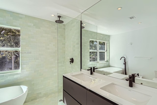 5812 Alton Rd, Miami Beach, FL 33140 - bathroom with a soaking tub, double vanity, a shower stall, and a sink