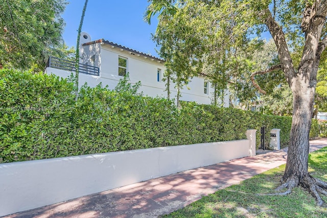 5812 Alton Rd, Miami Beach, FL 33140 - view of property exterior with stucco siding and a tiled roof