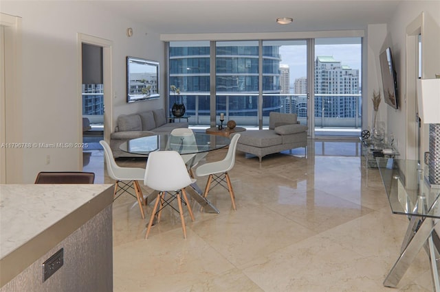 200 S Biscayne Blvd Unit 3903, Miami, FL 33131 - dining space with light marble finish floors and a city view
