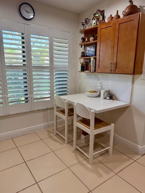12815 SW 71st Ln, Miami, FL 33183 - dining room featuring light tile patterned floors and baseboards
