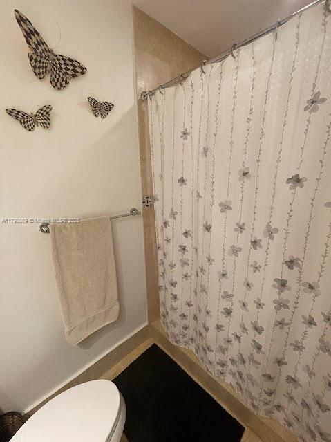 tiled bedroom featuring a ceiling fan and recessed lighting
