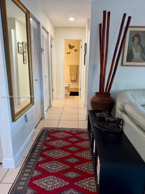 12815 SW 71st Ln, Miami, FL 33183 - corridor featuring light tile patterned floors and baseboards