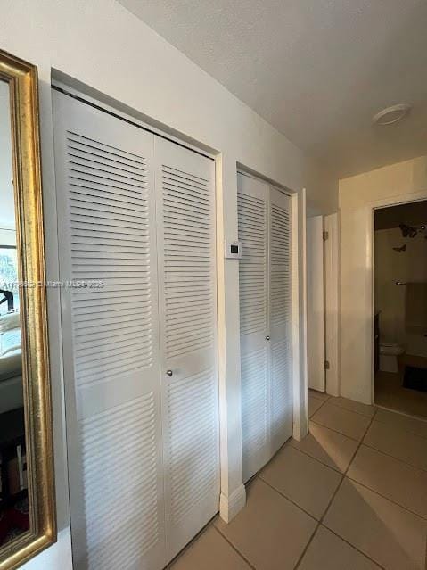 12815 SW 71st Ln, Miami, FL 33183 - hallway with light tile patterned floors