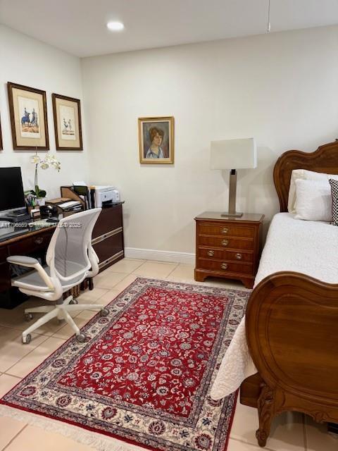 12815 SW 71st Ln, Miami, FL 33183 - bedroom with an office area, light tile patterned flooring, recessed lighting, and baseboards