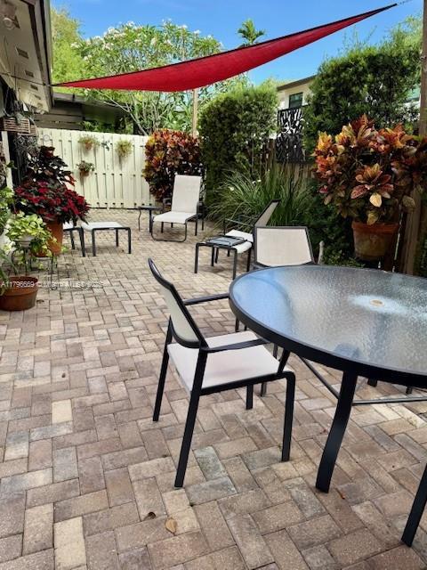 12815 SW 71st Ln, Miami, FL 33183 - view of patio with fence and outdoor dining area