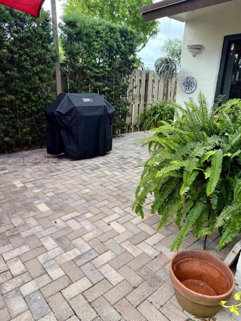 12815 SW 71st Ln, Miami, FL 33183 - view of patio featuring grilling area and fence