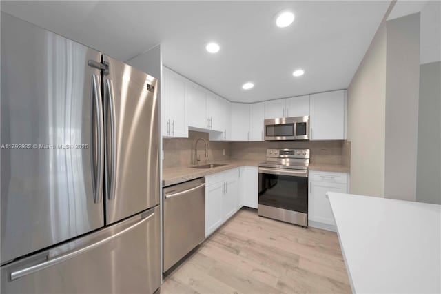 200 Galen Dr Unit 308, Key Biscayne, FL 33149 - kitchen with white cabinetry, appliances with stainless steel finishes, and a sink