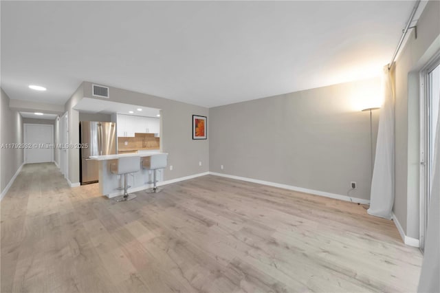 200 Galen Dr Unit 308, Key Biscayne, FL 33149 - unfurnished living room with baseboards, recessed lighting, light wood finished floors, and visible vents