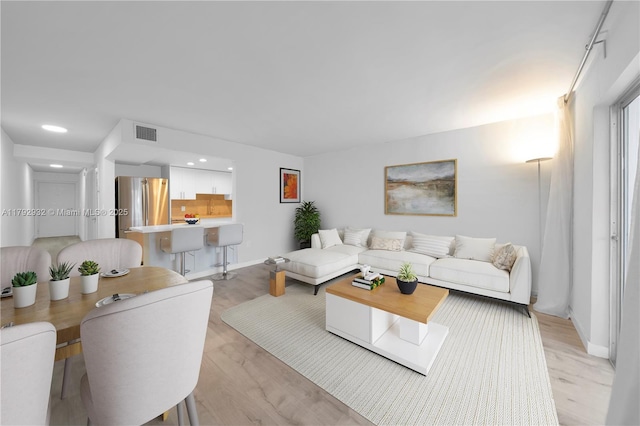 200 Galen Dr Unit 308, Key Biscayne, FL 33149 - living room featuring light wood-type flooring, visible vents, baseboards, and recessed lighting