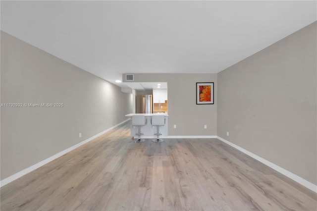 200 Galen Dr Unit 308, Key Biscayne, FL 33149 - unfurnished living room with light wood finished floors, visible vents, baseboards, and recessed lighting