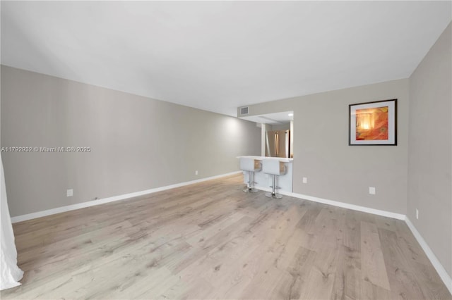 200 Galen Dr Unit 308, Key Biscayne, FL 33149 - unfurnished living room featuring light wood finished floors, baseboards, and visible vents