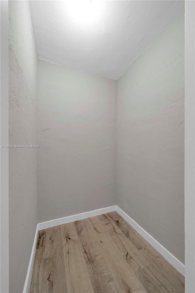 200 Galen Dr Unit 308, Key Biscayne, FL 33149 - spare room featuring baseboards and wood finished floors