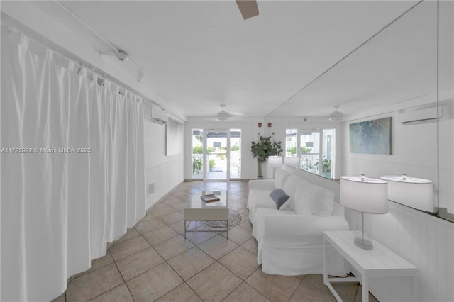 200 Galen Dr Unit 308, Key Biscayne, FL 33149 - living room with a wall mounted air conditioner, light tile patterned flooring, and a ceiling fan
