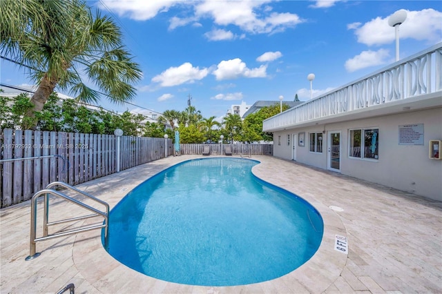 200 Galen Dr Unit 308, Key Biscayne, FL 33149 - community pool with a patio and a fenced backyard