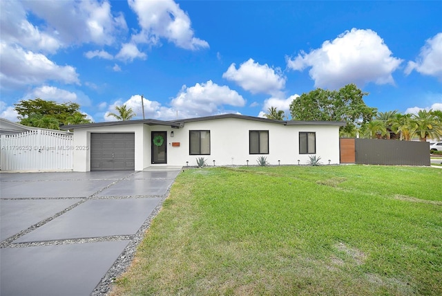 single story home with a garage, stucco siding, fence, a front yard, and driveway