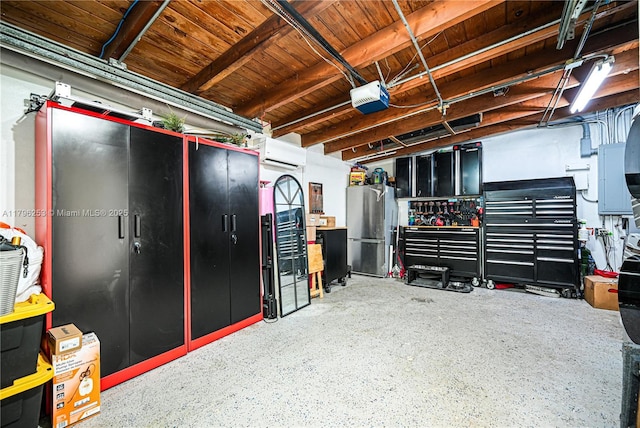 garage featuring freestanding refrigerator, a wall unit AC, and a garage door opener