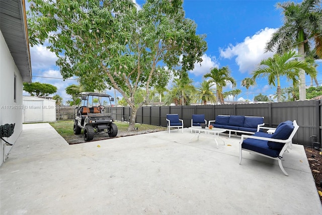 view of patio / terrace featuring a fenced backyard and an outdoor living space