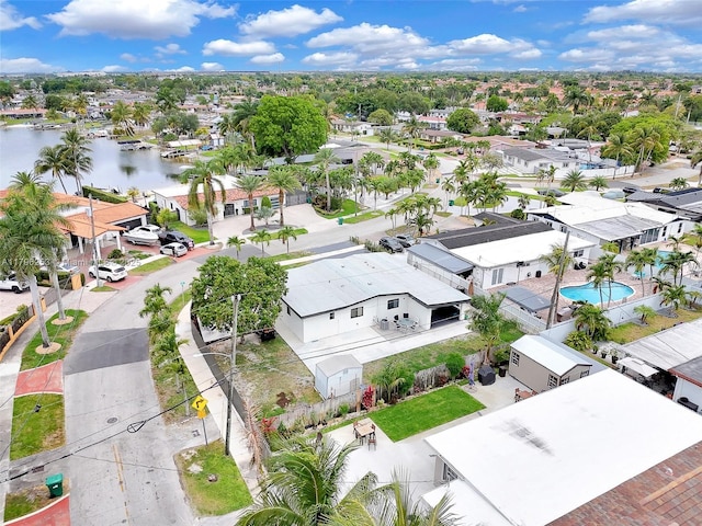bird's eye view with a water view and a residential view