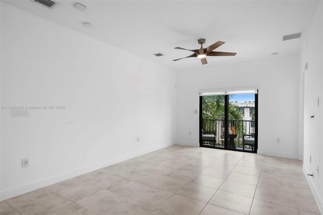 empty room with ceiling fan, visible vents, and light tile patterned flooring