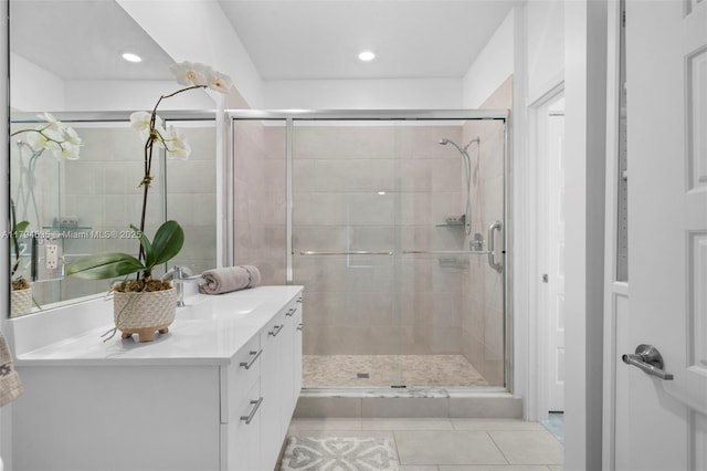 full bath with vanity, tile patterned flooring, a stall shower, and recessed lighting