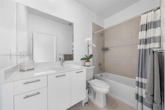 full bathroom with vanity, toilet, shower / bath combo, and tile patterned floors