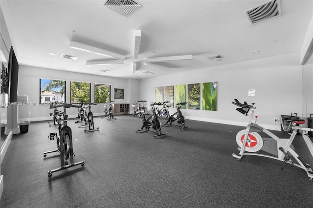 workout area with visible vents and baseboards