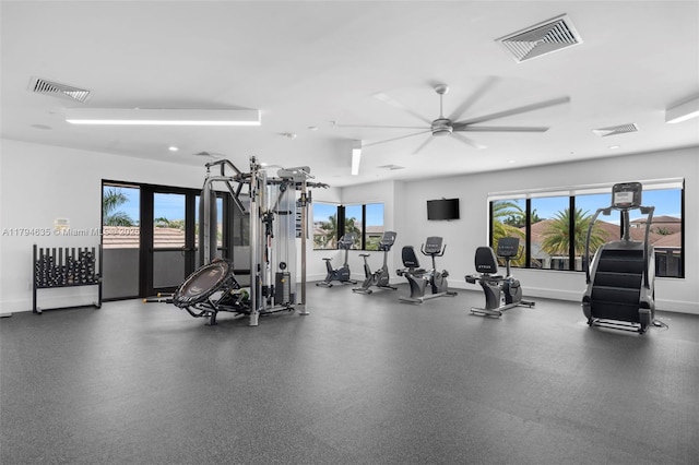 gym with visible vents, baseboards, and a ceiling fan